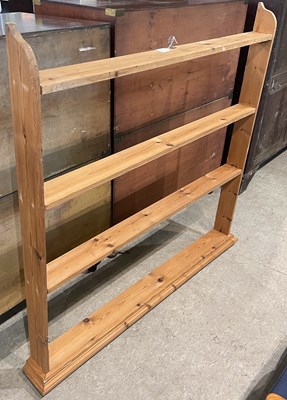 Lot 624 - A pine hanging shelf, with moulded cornice...
