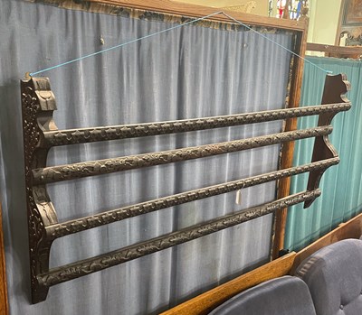 Lot 627 - A stained darkwood two tier open plate rack,...