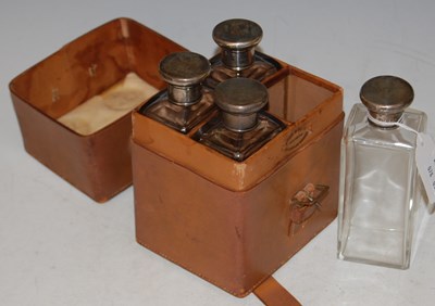 Lot 147 - A vintage leather-cased set of four silver...
