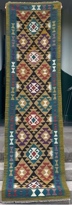 Lot 637 - A Maimana Kilim runner, the ochre ground...