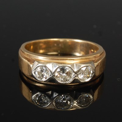 Lot 53L - A 14k gold large ring set with three diamonds,...