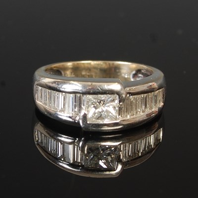Lot 53M - An 18k white gold ring, set with a princess...