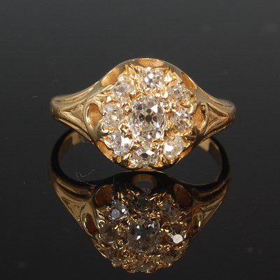 Lot 53E - A diamond cluster ring, set with a central old...