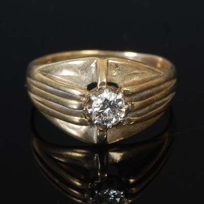 Lot 257A - A gold ring, set with a single diamond, in...