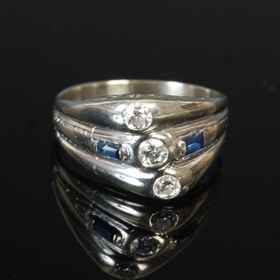 Lot 257P - An 18ct white gold dress ring, set with three...