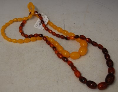 Lot 209 - Two vintage amber type necklaces