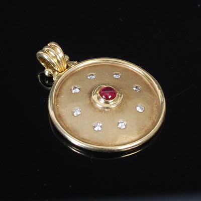 Lot 248I - A modern 18ct gold circular pendant, set with...
