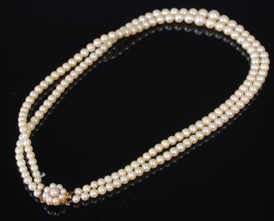 Lot 101C - A vintage yellow metal and pearl double strand...
