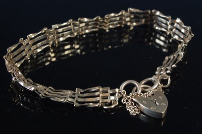 Lot 249 - A 9ct gold gatelink bracelet with 9ct gold...