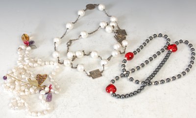 Lot 259B - Majliya by Jawahir, Oman, a pearl and white...