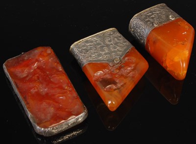 Lot 259C - Three Middle Eastern white metal mounted amber...