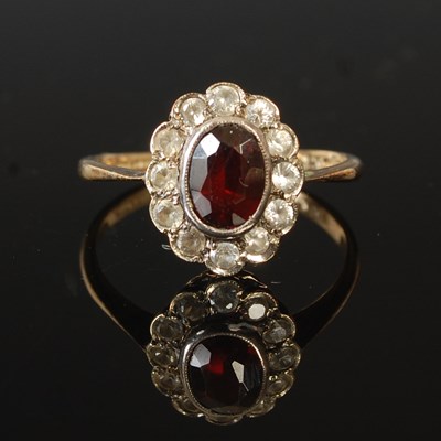 Lot 204E - A vintage white and yellow metal, garnet and...