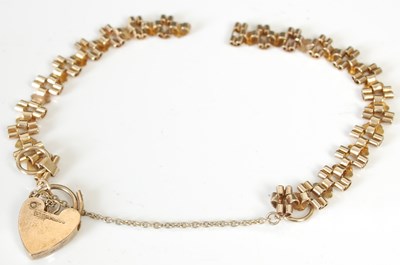 Lot 204I - A 9ct gold bracelet, in two parts, suspending...