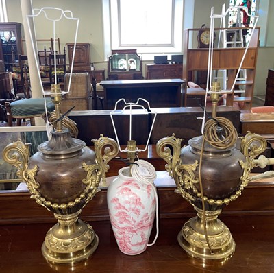 Lot 596A - A pair of gilt metal twin-handled table lamps,...