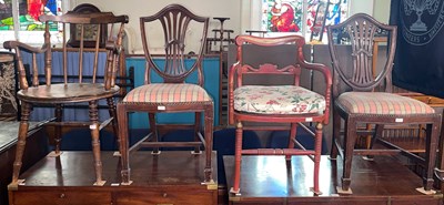Lot 619A - A group of four chairs comprising a pair of...