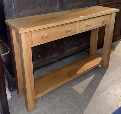 Lot 624B - A modern blonde oak console table, fitted with...