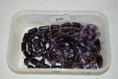 Lot 216 - A collection of assorted amethyst coloured...