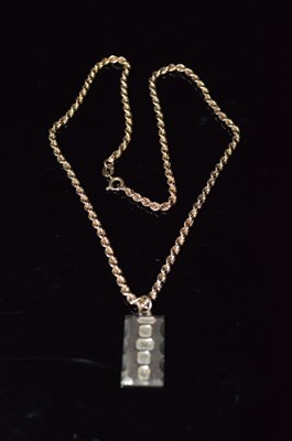 Lot 50E - A 9ct gold ingot pendant on 9ct gold chain,...
