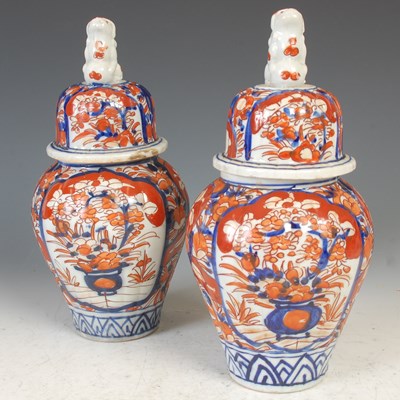 Lot 393 - A pair of Japanese Imari porcelain jars and...