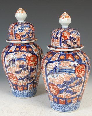Lot 390 - A pair of Japanese Imari porcelain jars and...