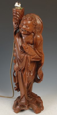 Lot 370 - A Chinese carved wood figure of a fisherman,...