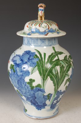 Lot 404 - A Chinese porcelain Wucai jar and later cover,...
