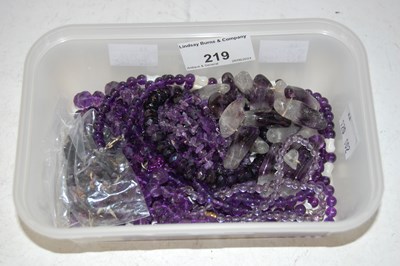 Lot 219 - A collection of assorted amethyst coloured...