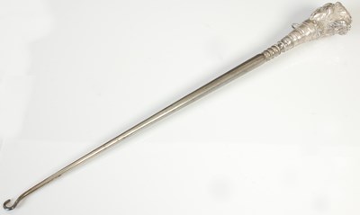 Lot 146 - A Victorian silver mounted boot hook, the...