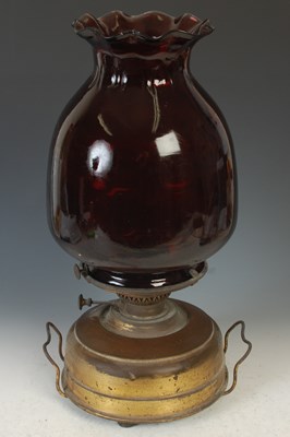 Lot 355 - A late 19th century oil burning heater lamp...