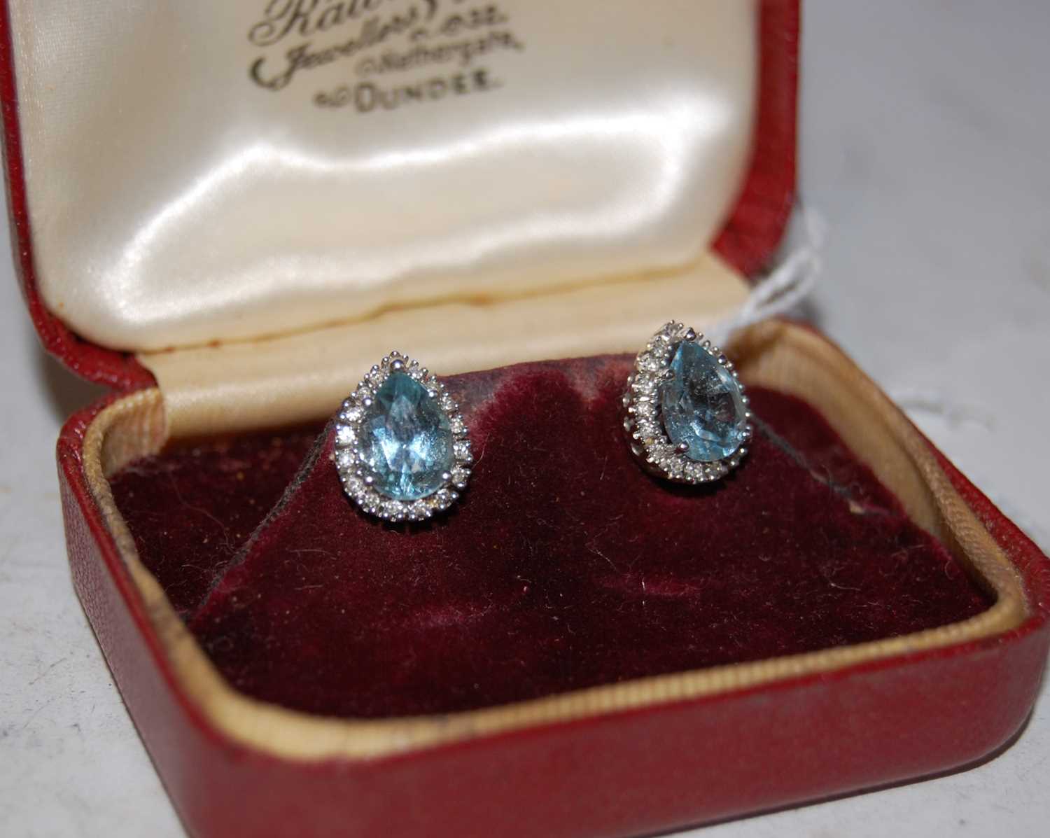 Lot 61 - A pair of white metal aquamarine and diamond...