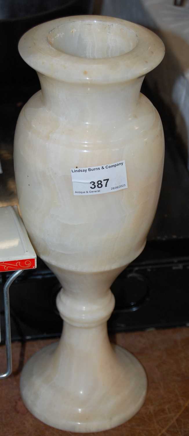 Lot 387 - A white alabaster turned vase