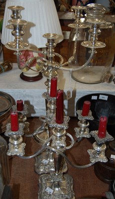 Lot 395 - A pair of plated three-light candelabra...