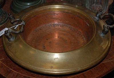 Lot 398 - A brass and copper twin handled warming dish /...