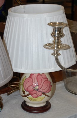 Lot 401 - A Moorcroft table lamp, the white ground...