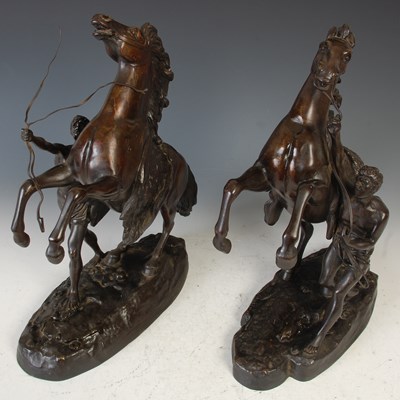 Lot 336 - A pair of bronze Marly Horse figure groups...