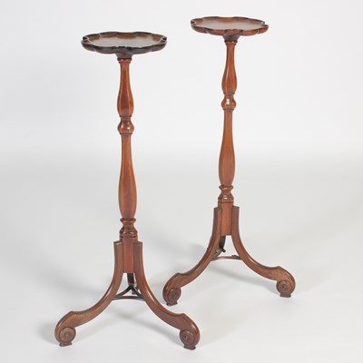 Lot 661 - A pair of George III style mahogany torcheres,...