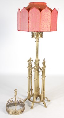 Lot 739 - A Gothic style brass standard lamp and shade,...