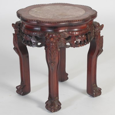 Lot 700 - A Chinese darkwood urn stand, late 19th...