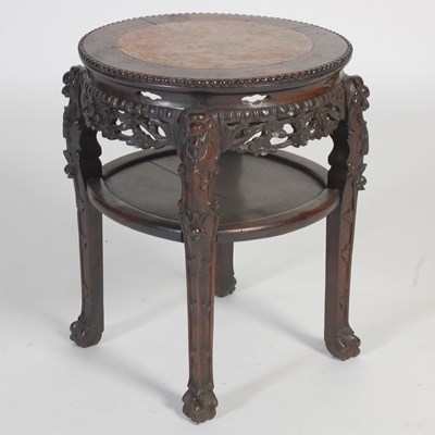 Lot 758 - A Chinese darkwood urn stand, late 19th...