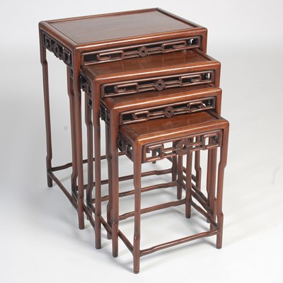 Lot 787 - A nest of four Chinese darkwood occasional...