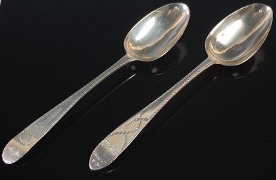 Lot 144 - Two Irish silver table spoons, engraved with...