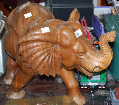 Lot 381 - A teak elephant