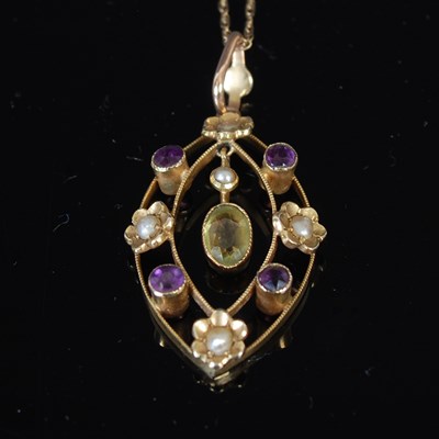 Lot 239 - An Edwardian 9ct gold pendant and chain, set...