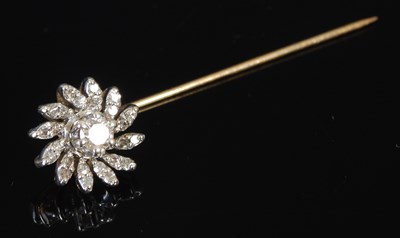 Lot 222 - A gold and diamond tie pin, formed as a...