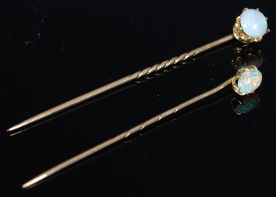 Lot 225 - Two gold and opal single stone tie pins, one...