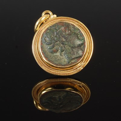 Lot 232 - An antique Roman bronze coin, in a gold...