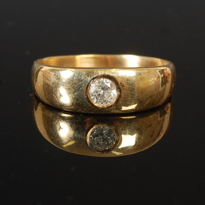 Lot 75 - An 18ct gold ring, with a gypsy set single...