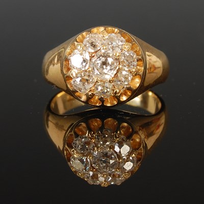 Lot 57 - An 18ct gold and diamond cluster ring, set...