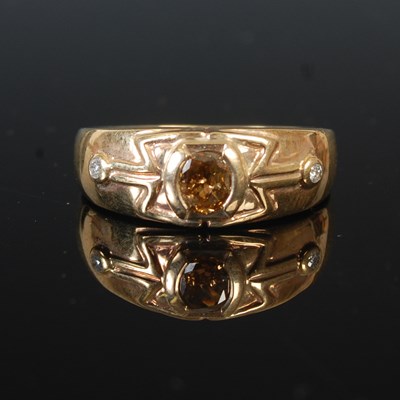 Lot 54 - A 9ct gold ring, set with an oval cut brown...