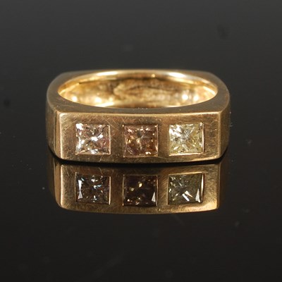 Lot 60 - An 9ct gold gents dress ring, set with three...